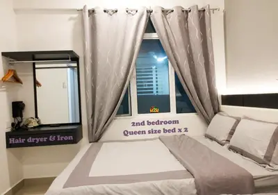 a bedroom with a bed with a window and a curtain at H2H - CosyStay @ Majestic Ipoh Town Central in Ipoh