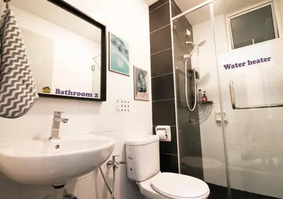 a bathroom with a sink and a toilet and a shower at H2H - CosyStay @ Majestic Ipoh Town Central in Ipoh