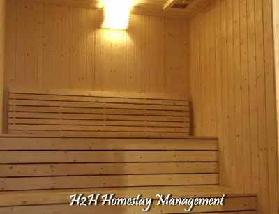 a sauna with a bench and a light in it at H2H - CosyStay @ Majestic Ipoh Town Central in Ipoh