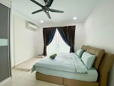 a bedroom with a bed and a ceiling fan at Apartment@Mansion One Georgetown in George Town
