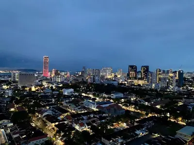 a view of a city at night with at Apartment@Mansion One Georgetown in George Town