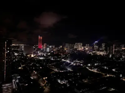 a view of a city at night with lights at Apartment@Mansion One Georgetown in George Town