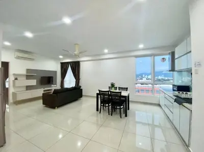 a living room with a couch and a table with chairs at Apartment@Mansion One Georgetown in George Town