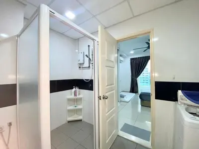 a small bathroom with a shower and a toilet at Apartment@Mansion One Georgetown in George Town