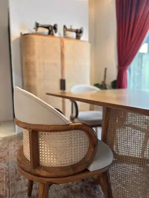 a wooden table with two chairs and a table with sinks at The White Horse in Cameron Highlands