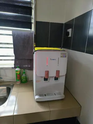 a small appliance sitting on a counter in a kitchen at 61 Homestay in Sitiawan