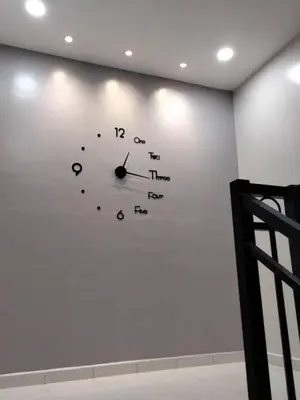 a clock on a wall in a room at 61 Homestay in Sitiawan