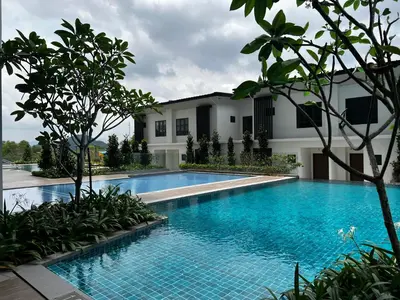 a swimming pool in front of a building at Ipoh Peaceful Onsen studio Lost World Tambun in Tambun