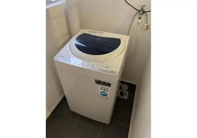 a trash can in a corner of a bathroom at ROMANCE FULL HOUSE THREE PREMIER SUITE in Butterworth