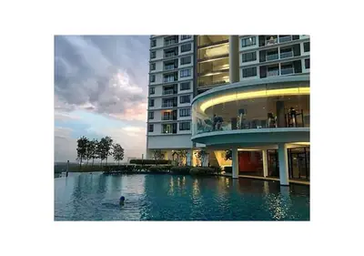 a swimming pool in front of a building at ROMANCE FULL HOUSE THREE PREMIER SUITE in Butterworth