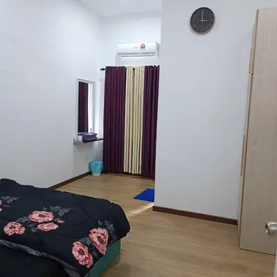 a bedroom with a bed and a heater on the wall at SBB Star Homestay in Sungai Petani