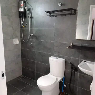 a bathroom with a toilet and a shower and a sink at SBB Star Homestay in Sungai Petani