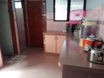 a kitchen with a counter and a counter top at Idaman guesthouse Malay FAMILY ONLY in Kubang Semang