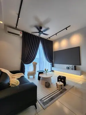 a living room with a couch and a flat screen tv at JOMSTAY Sunway Onsen Suites Ipoh - Lost World of Tambun Ipoh Waterpark in Tambun
