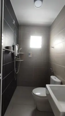a bathroom with a toilet and a sink at Gopeng Serumah Holiday House in Gopeng