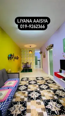 a living room with a couch and a tile floor at LIYANA AAISYA HOMESTAY - 10 UNITs - JOINT VENTURE PARTNERS in Tanah Rata