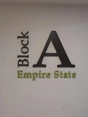 a company logo is pictured at a company headquarters at Ipoh Homestay - Manhattan Condominium with Water Park & Leisure Facilities in Ipoh