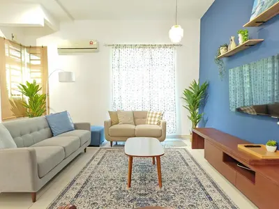 a living room with a couch and a table at Ocean 27 Batu Ferringhi Shamrock Beach 6 Bedroom 22pax with Pool in Batu Ferringhi