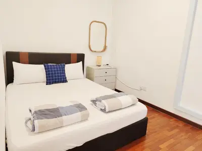 a bedroom with a large white bed with a mirror at Ocean 27 Batu Ferringhi Shamrock Beach 6 Bedroom 22pax with Pool in Batu Ferringhi