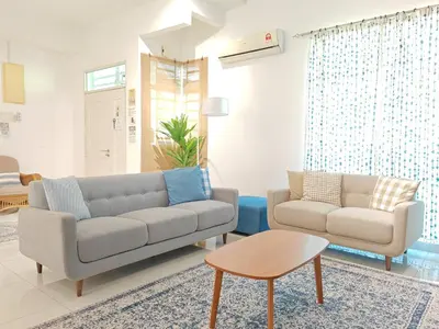 a living room with a couch and a table at Ocean 27 Batu Ferringhi Shamrock Beach 6 Bedroom 22pax with Pool in Batu Ferringhi