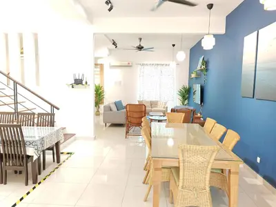 a dining room with a table and chairs at Ocean 27 Batu Ferringhi Shamrock Beach 6 Bedroom 22pax with Pool in Batu Ferringhi