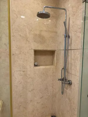 a shower stall with a glass door and a shower at Lucky Waterfront at Straits Quay Seaview or Non in Bagan Jermal