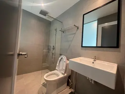 a bathroom with a toilet and a sink and a mirror at Ninety Guest House in Ipoh