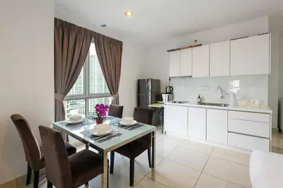 a kitchen and dining room with a table and chairs at Comfy Studio/Gurney/Mansion One in George Town