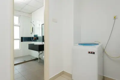 a white bathroom with a sink and a toilet at Comfy Studio/Gurney/Mansion One in George Town
