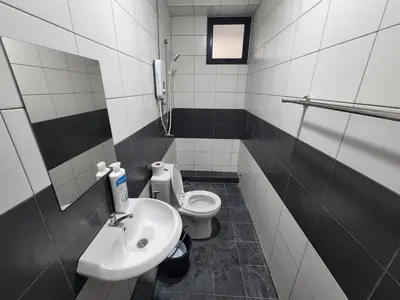 a bathroom with a sink and a toilet at Praicon Tower - Premium Suite in Butterworth