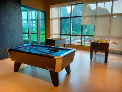 a billiard room with a pool table and two tables at Studio in Sunway Onsen @ Lost World of Tambun for 4 in Ipoh