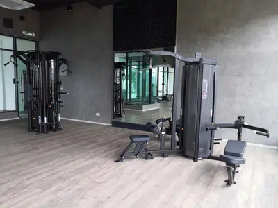 a gym with several tread machines and a mirror at Studio in Sunway Onsen @ Lost World of Tambun for 4 in Ipoh