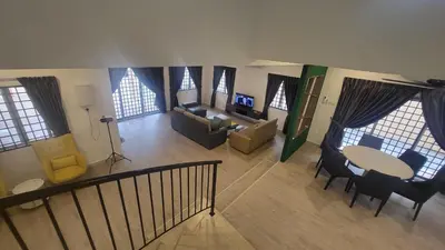 an aerial view of a living room with a table and chairs at Ipoh Family Villa-Spacious Stay for 21 or 42Pax in Ipoh