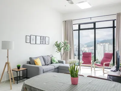 a living room with a couch and a table at Beacon Executive Suites by S&F #InfinityPool #SkyGym in George Town