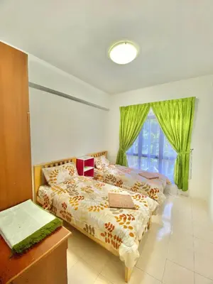 a bedroom with a bed and a window at Homestay Legacy Kamariah Ahmad,Lumut in Lumut