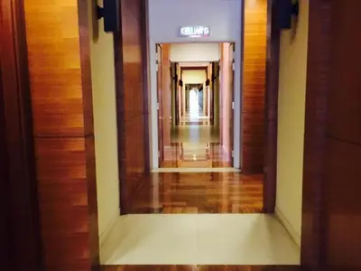 a hallway in a building with a sign on the wall at Perfect Marina Stay@ Strait Quay /w Big Balcony + Carpark in Bagan Jermal