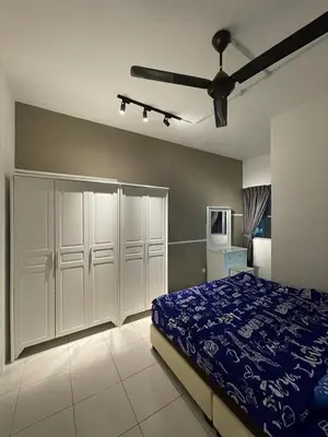 a bedroom with a bed and a ceiling fan at Cameron Sweet Muslim Apartment 2 - Iiqoma Muslim Homestay in Tanah Rata