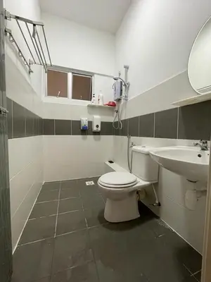 a bathroom with a toilet and a sink at Cameron Sweet Muslim Apartment 2 - Iiqoma Muslim Homestay in Tanah Rata