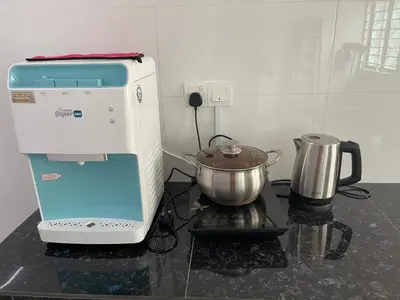 a kitchen with a mixer and a pot on a stove at KY Happiness Homestay Tanjong Karang \u5feb\u4e50\u6c11\u5bbf in Tanjung Karang