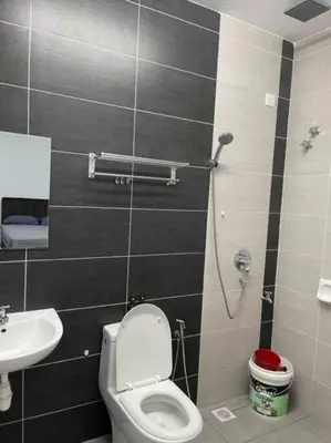 a bathroom with a toilet and a sink at KY Happiness Homestay Tanjong Karang \u5feb\u4e50\u6c11\u5bbf in Tanjung Karang
