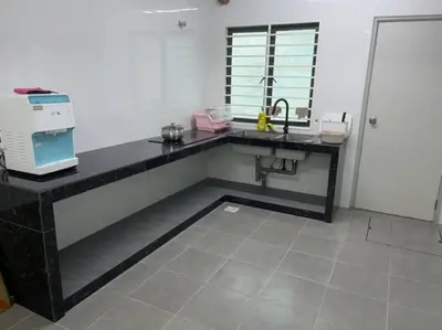 a kitchen with a counter with a sink and a microwave at KY Happiness Homestay Tanjong Karang \u5feb\u4e50\u6c11\u5bbf in Tanjung Karang