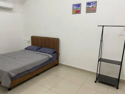 a bedroom with a bed in a room at KY Happiness Homestay Tanjong Karang \u5feb\u4e50\u6c11\u5bbf in Tanjung Karang