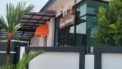 a building with a sign on the side of it at Fairy Retreat Private Pool Cottage IPOH, BBQ, KTV, 10-12 pax in Ipoh