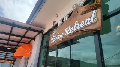 a sign on the front of a store at Fairy Retreat Private Pool Cottage IPOH, BBQ, KTV, 10-12 pax in Ipoh