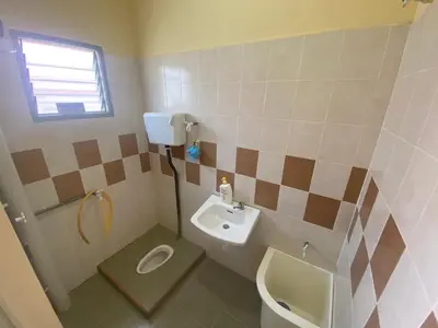 a small bathroom with a sink and a toilet at Homestay Cikgu Muaz in Kuala Kangsar