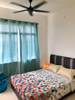 a bedroom with a bed and a ceiling fan at ECO Apartment (Ipoh Falim) -2B2B in Ipoh