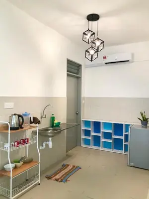 a kitchen with blue and white tiles and a sink at ECO Apartment (Ipoh Falim) -2B2B in Ipoh