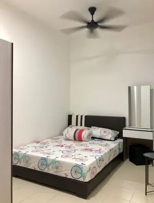 a bedroom with a bed with a ceiling fan at ECO Apartment (Ipoh Falim) -2B2B in Ipoh
