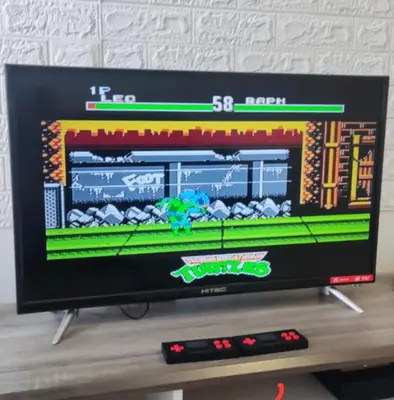 a flat screen tv sitting on a table with two remote controls at ECO Apartment (Ipoh Falim) -2B2B in Ipoh
