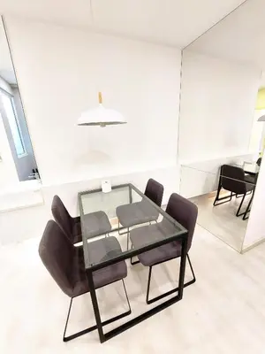 a glass table and chairs in a room at SG10-4Pax 2rooms Studio Georgetown in George Town